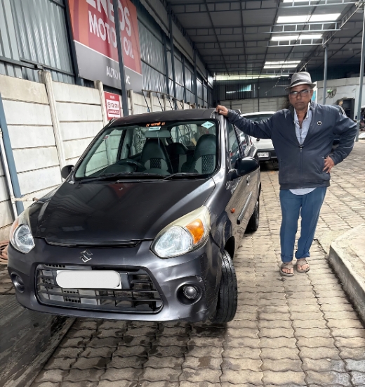 Professional technician performing complete car servicing in Pune at Auto Clinic, including engine inspection, oil change, and preventive vehicle maintenance.